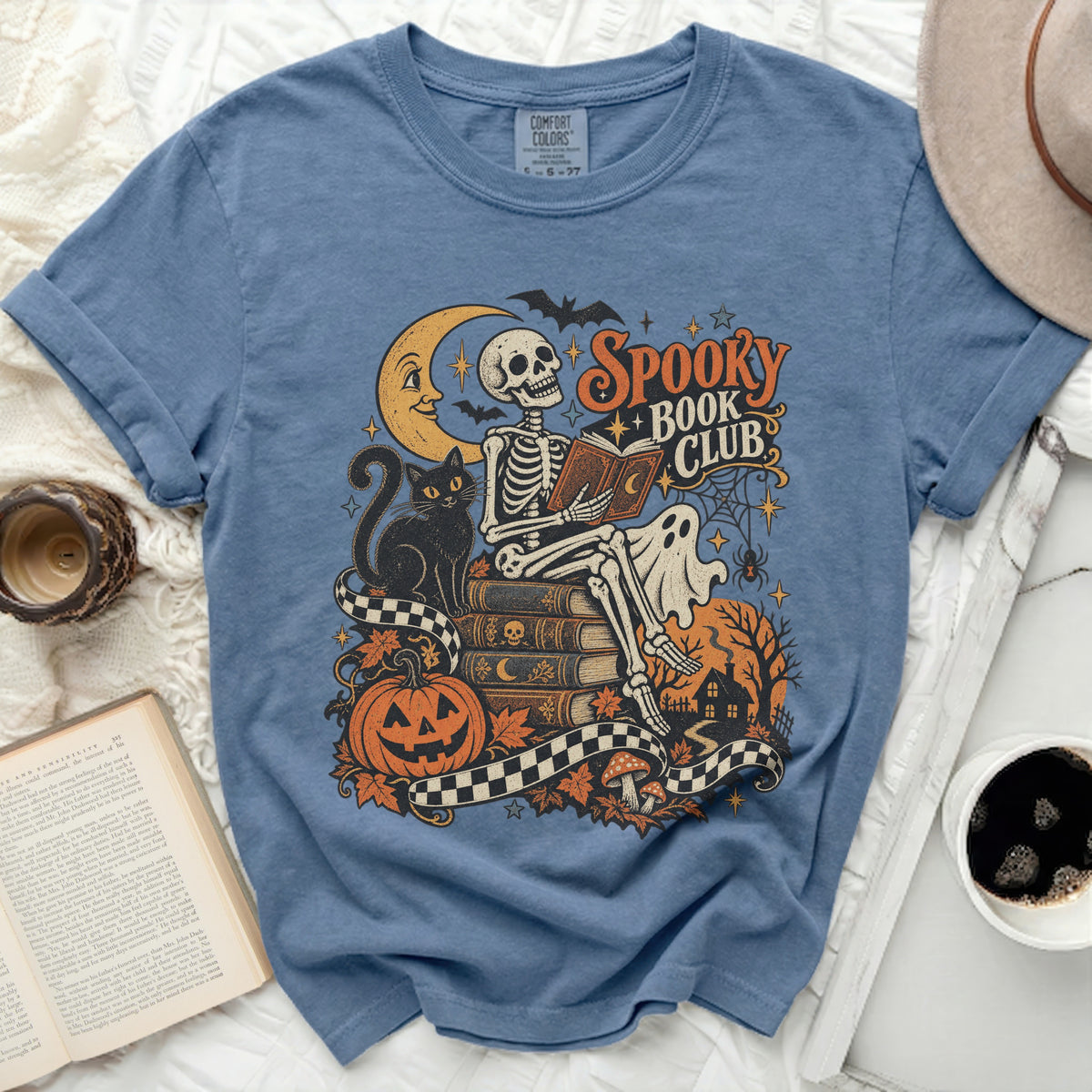 Skeleton reading book with "Spooky Book Club" text, moon, bats, and Halloween icons.