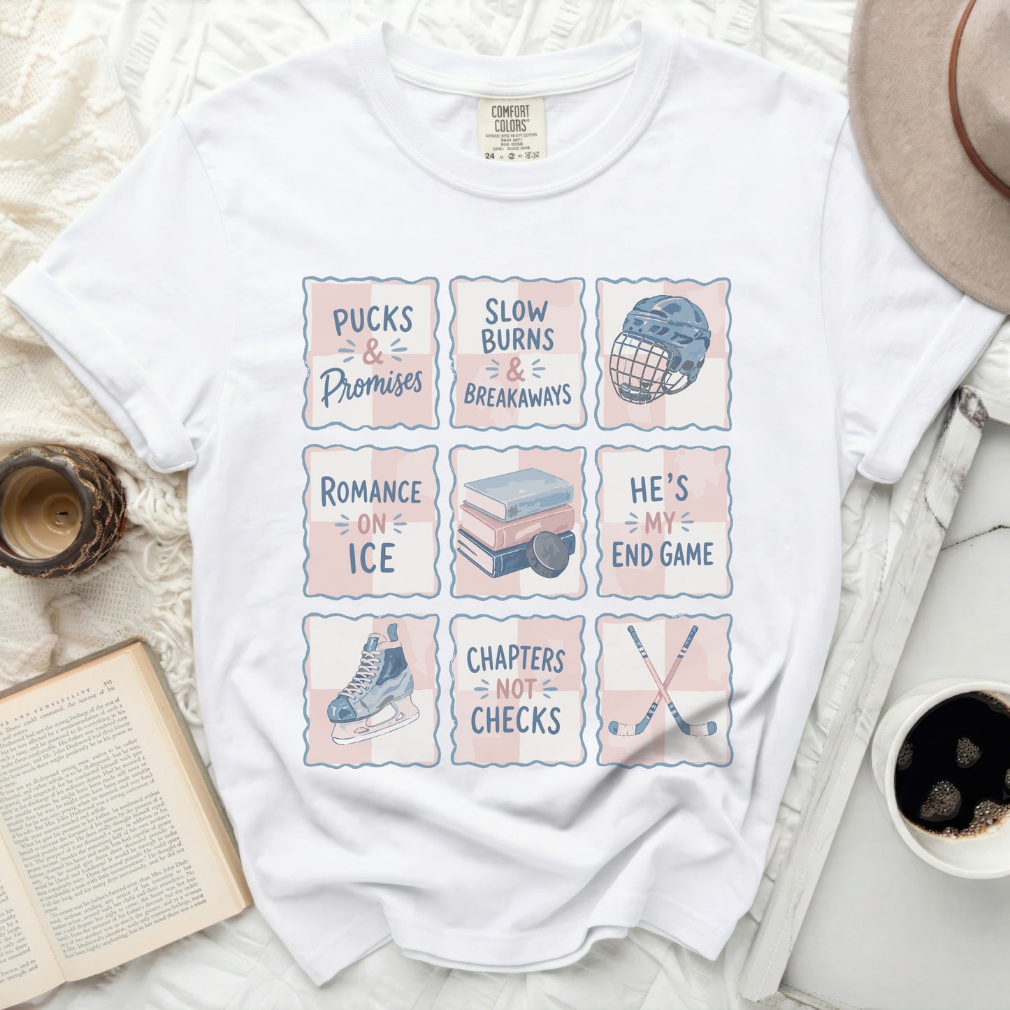 White t-shirt with "Pucks & Promises", "Slow Burns & Breakaways", "He's My End Game", and "Chapters Not Checks" text designs.