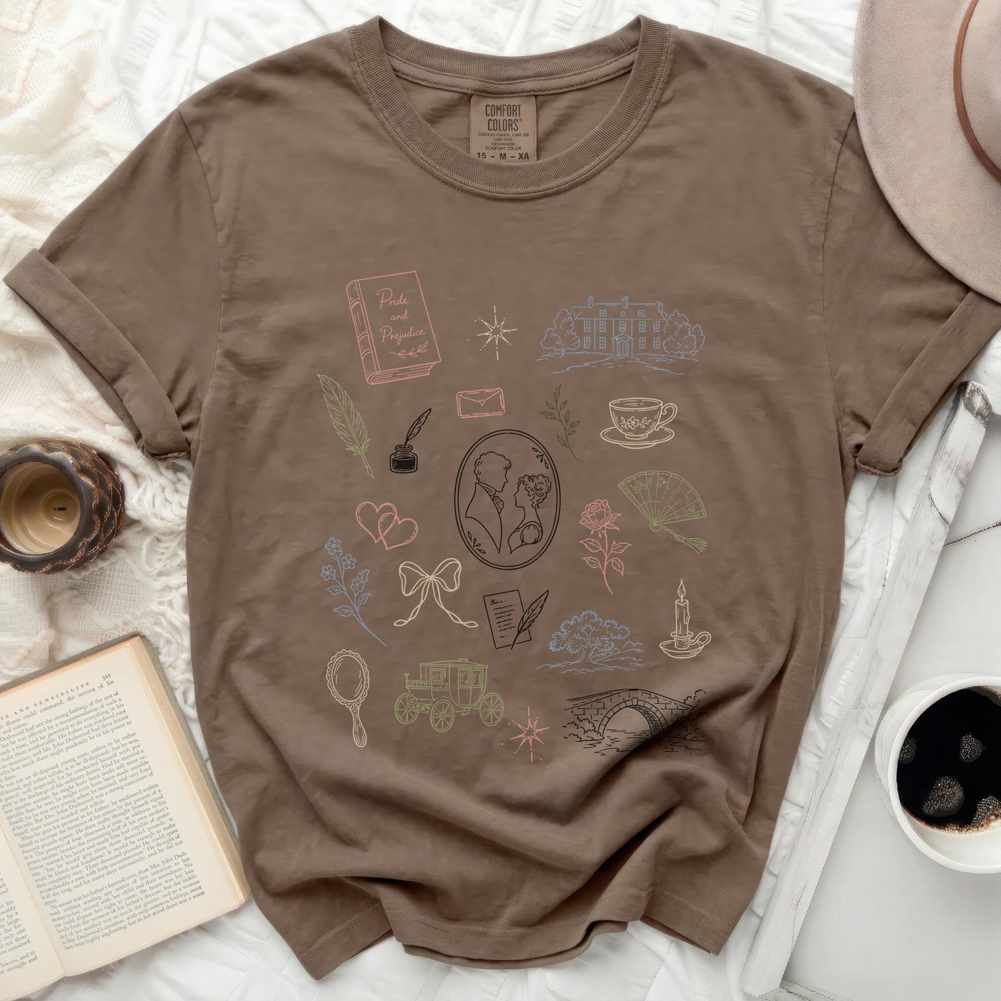 Brown t-shirt with a pattern of "Pride and Prejudice" illustrations.