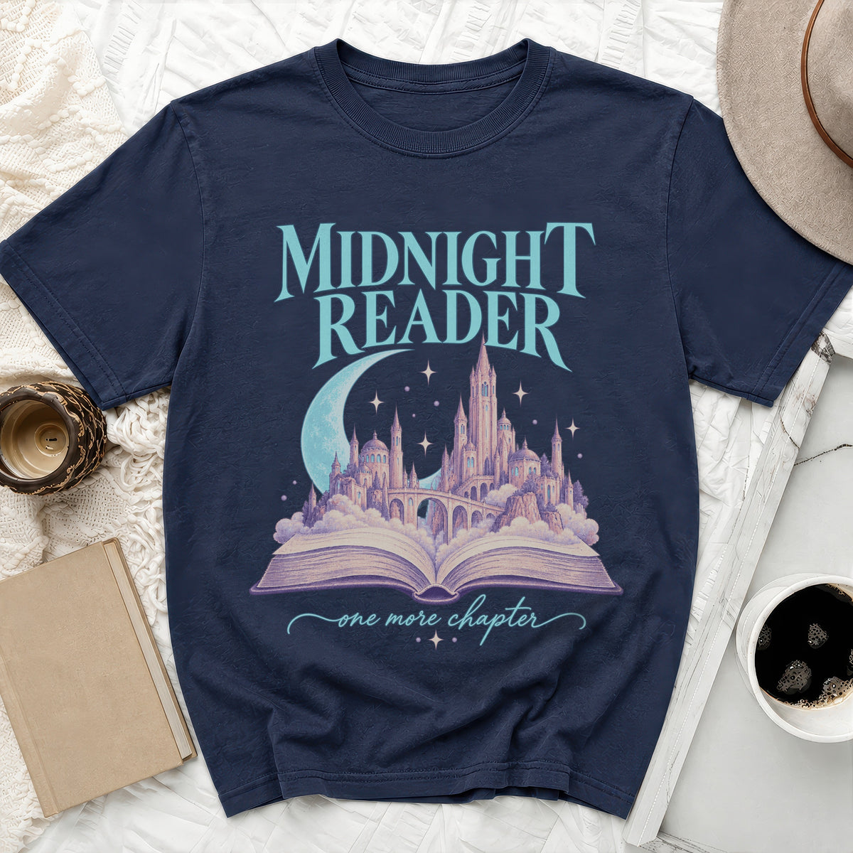 Navy t-shirt with "Midnight Reader" text and castle illustration on an open book.