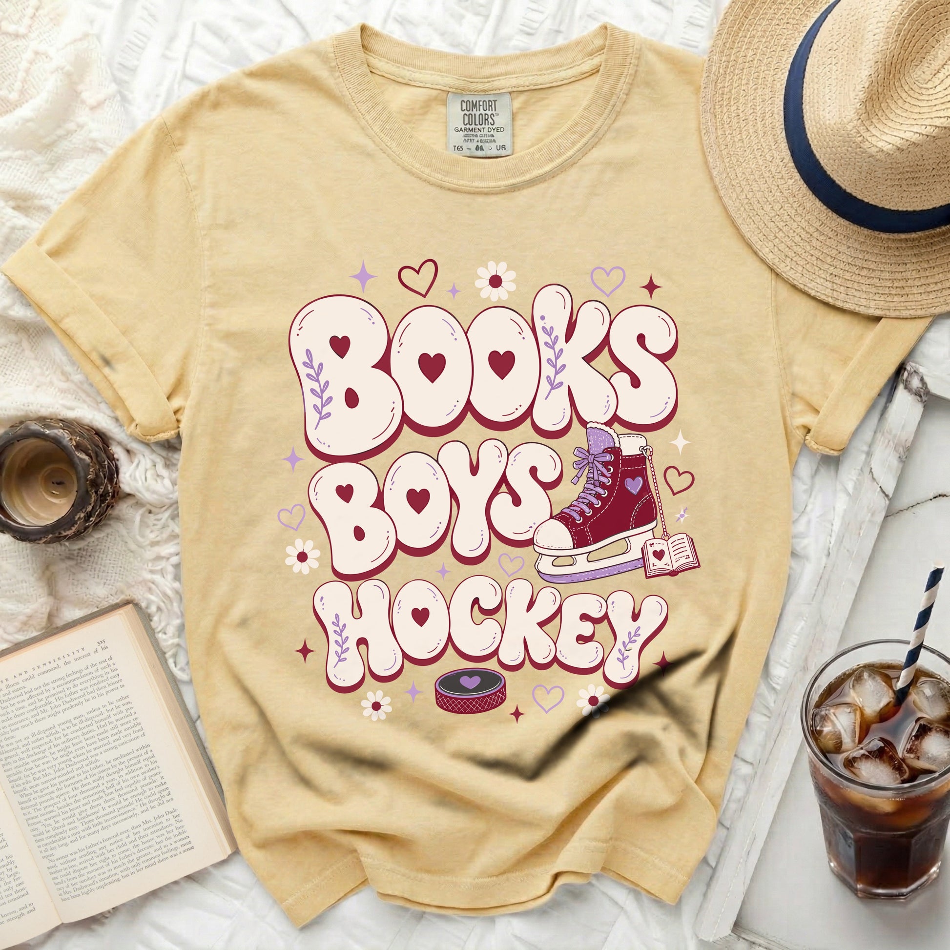 Yellow t-shirt with "Books Boys Hockey" text, ice skate, and hearts.
