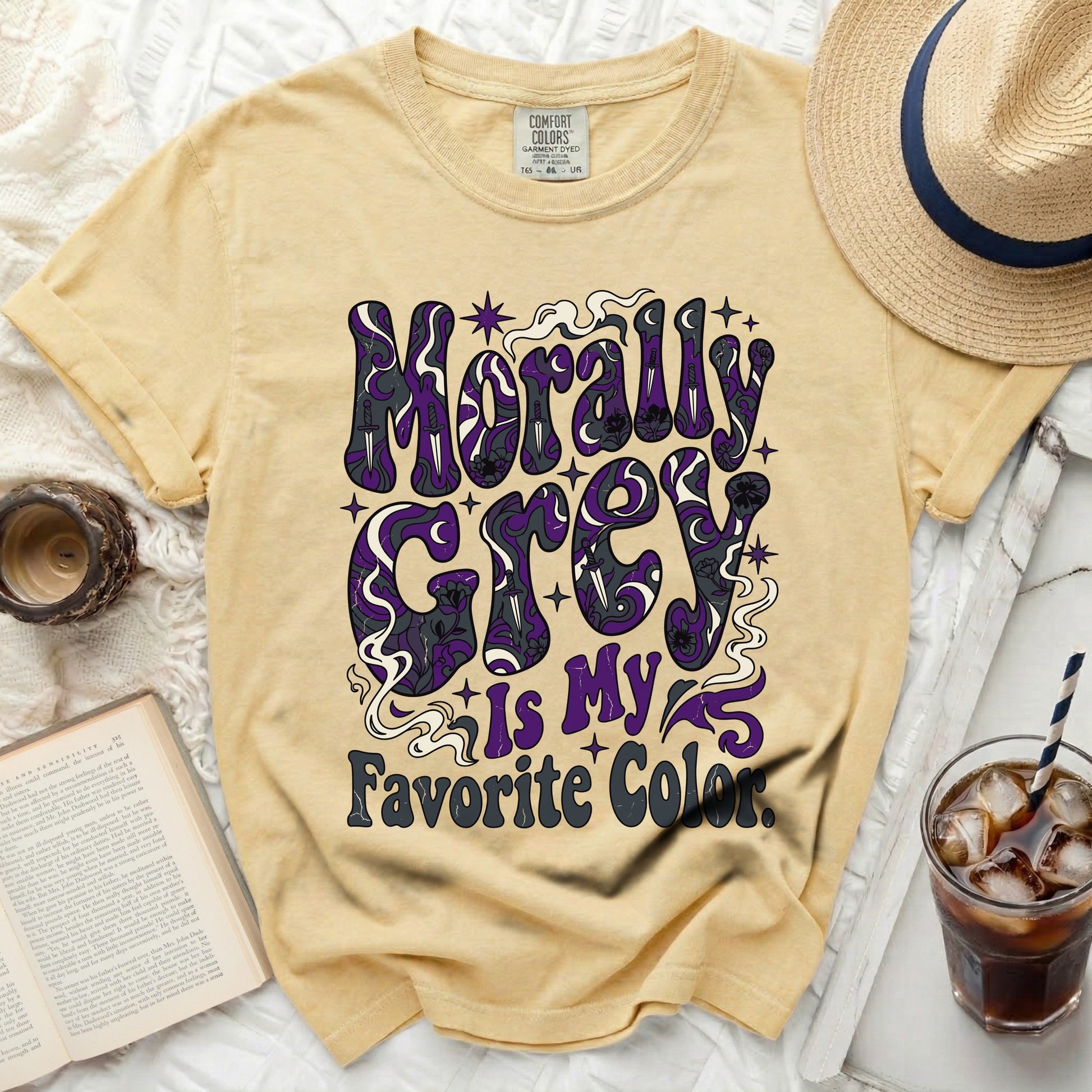Yellow t-shirt with "Morally Grey is My Favorite Color" graphic.