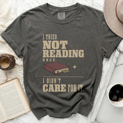 Dark gray t-shirt with "I TRIED NOT READING ONCE. I DIDN'T CARE FOR IT." text.
