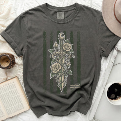 Dark green t-shirt with sword, roses, moon, and text "sword and roses reader."