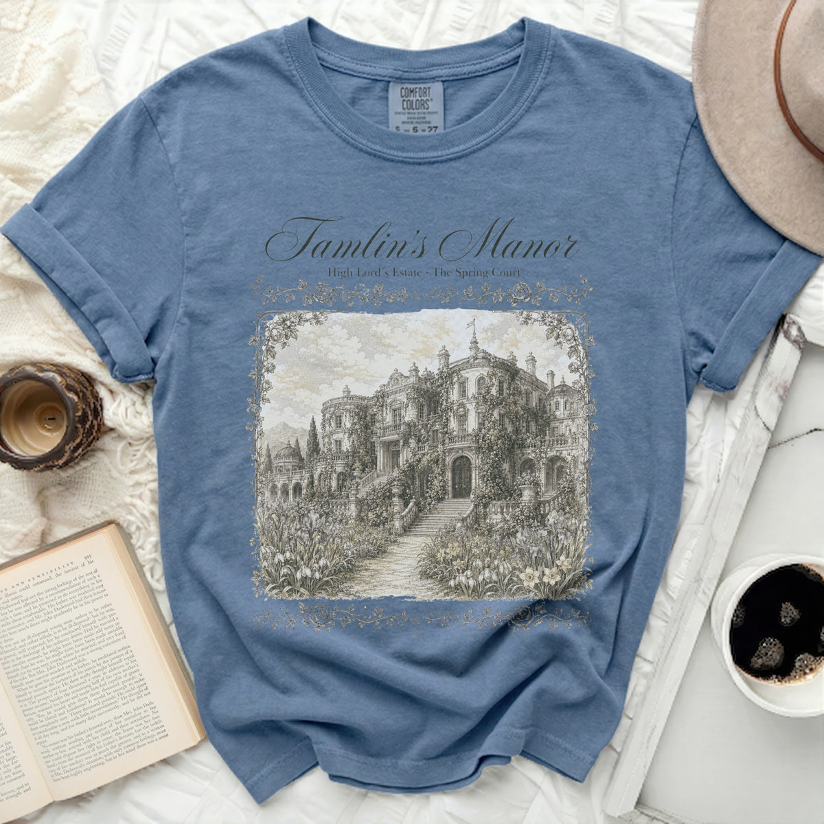 Blue t-shirt with "Tamlin's Manor" and a manor illustration.