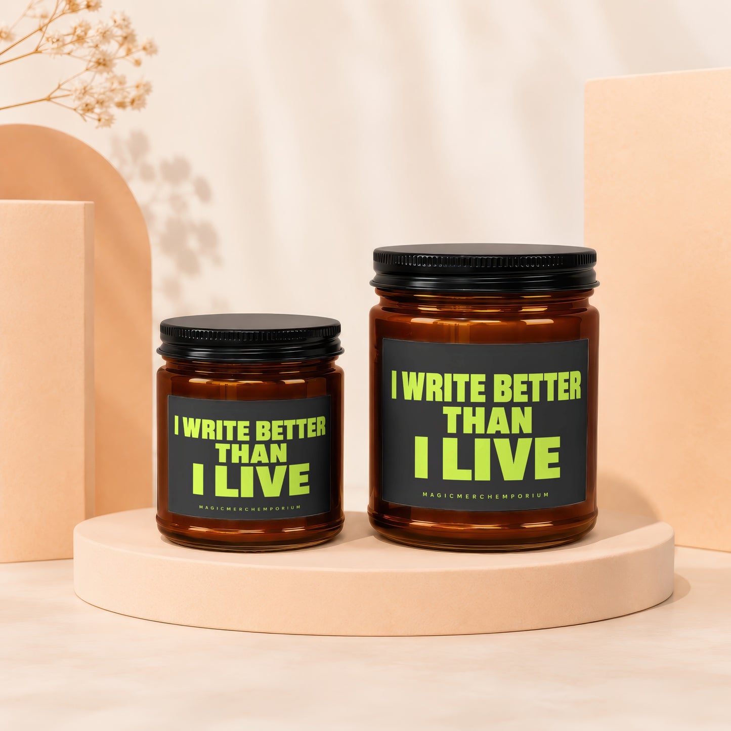 Two amber jars with black lids display "I WRITE BETTER THAN I LIVE" on black labels.