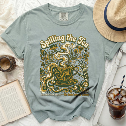 Comfort Colors sage green t-shirt with "Spilling the Tea" graphic.