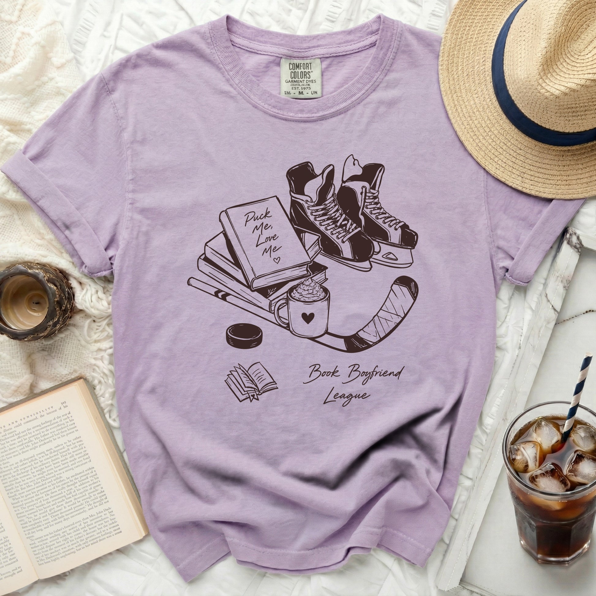Lilac t-shirt with "Puck Me Love Me Book Boyfriend League" graphic.