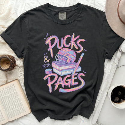 T-shirt with "Pucks & 2026 PAGES" text, hockey puck, and books.