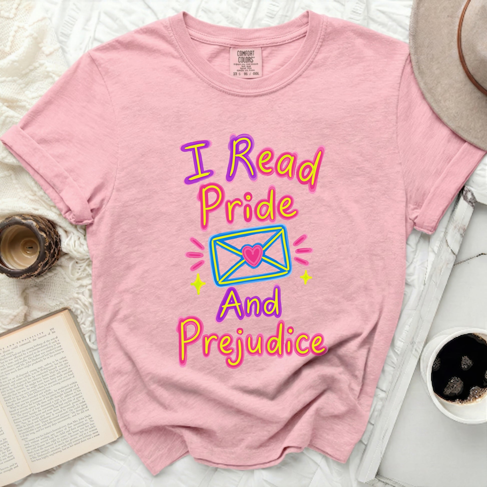 Pink Comfort Colors t-shirt with "I Read Pride And Prejudice" text