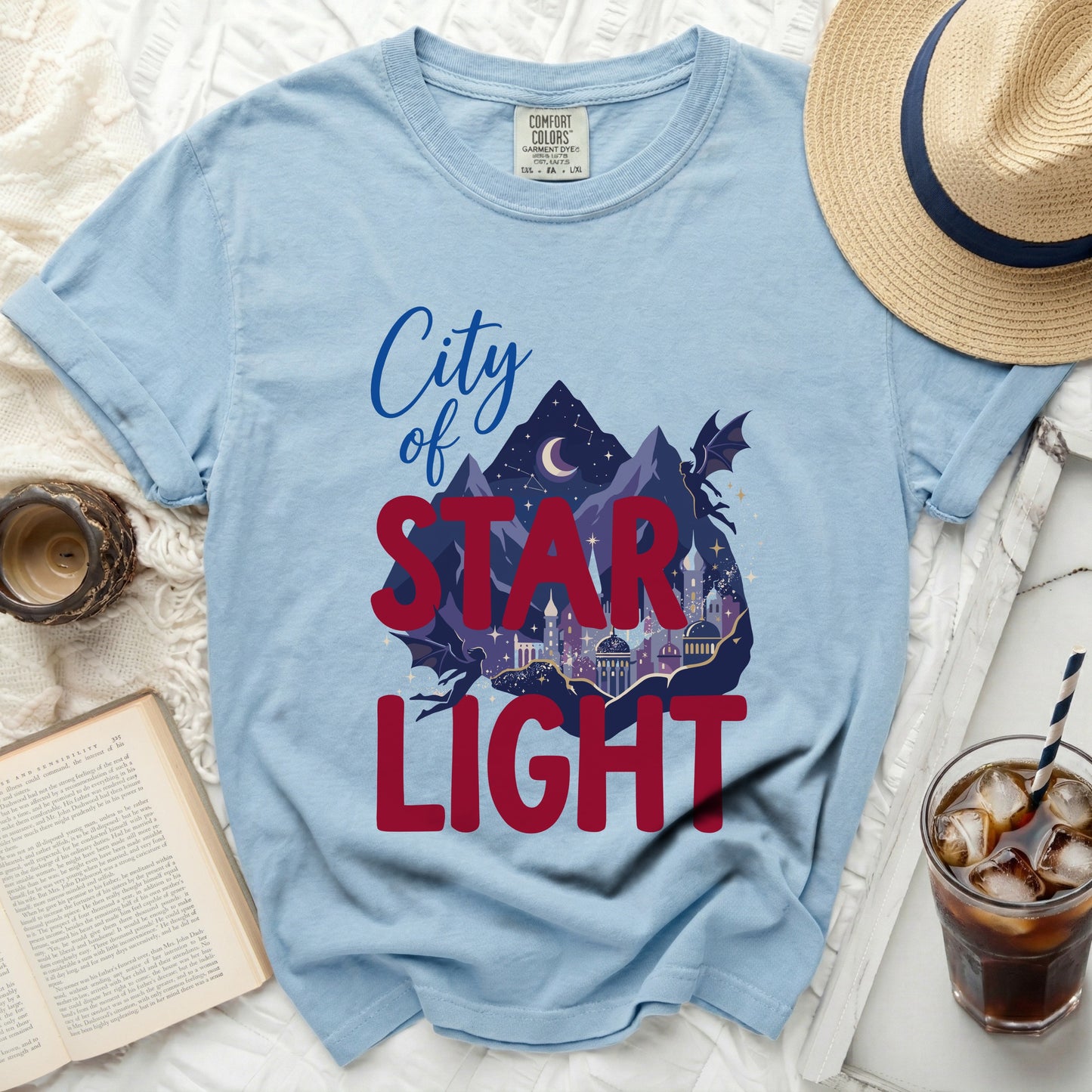 Light blue t-shirt with "City of Star Light" graphic and a dragon.