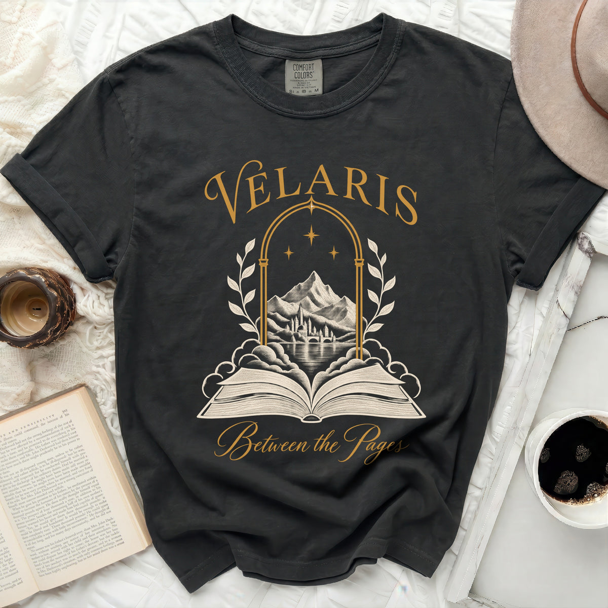 Dark t-shirt with "Velaris Between the Pages" and arched scene.