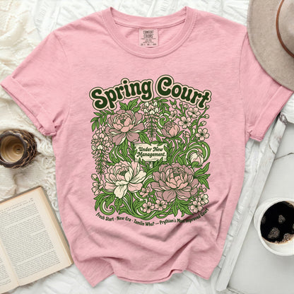 Pink t-shirt with "Spring Court Under New Management" floral design.