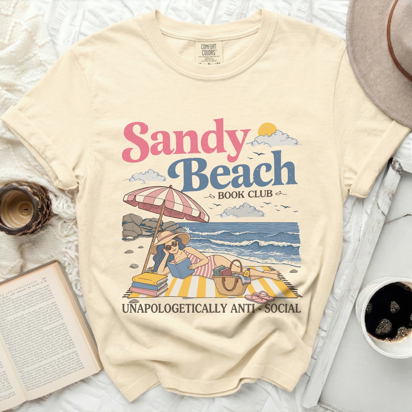 Sandy Beach Book Club graphic on a light yellow t-shirt.