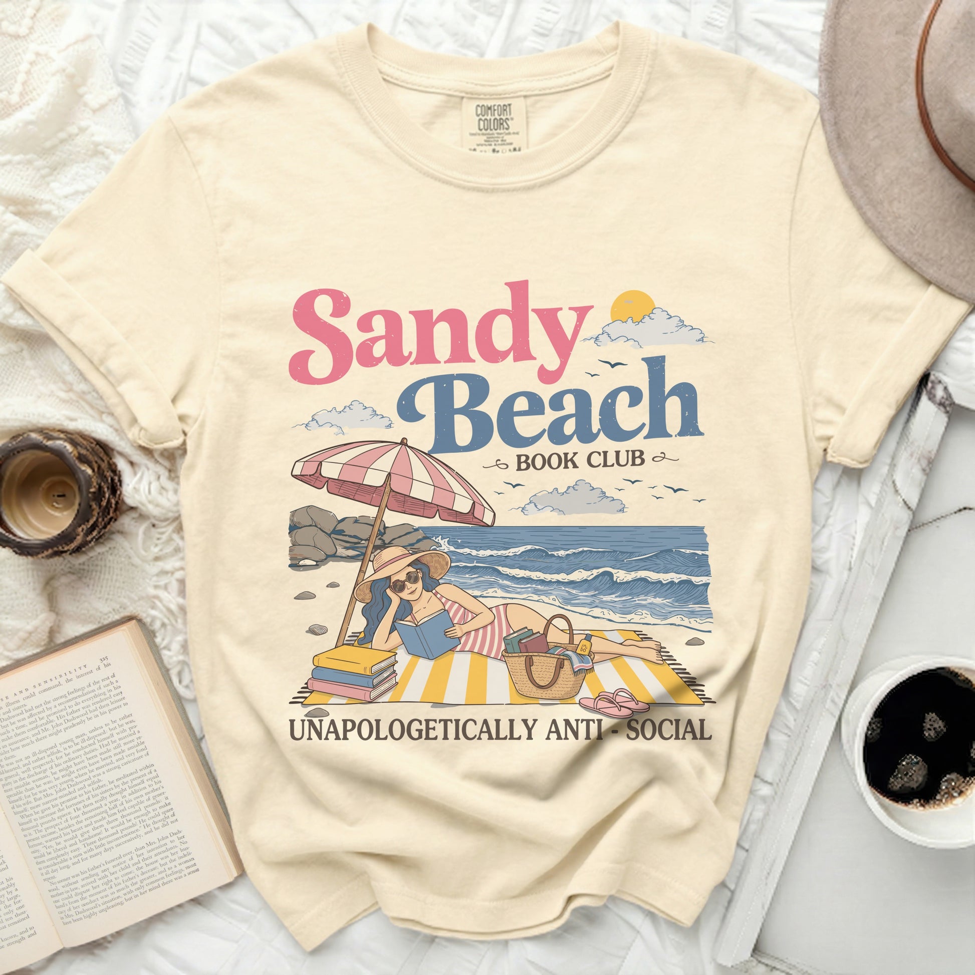 Sandy Beach Book Club graphic on a light yellow t-shirt.