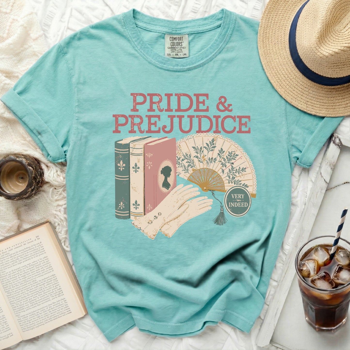 Turquoise t-shirt with "Pride & Prejudice" design and vintage illustrations.