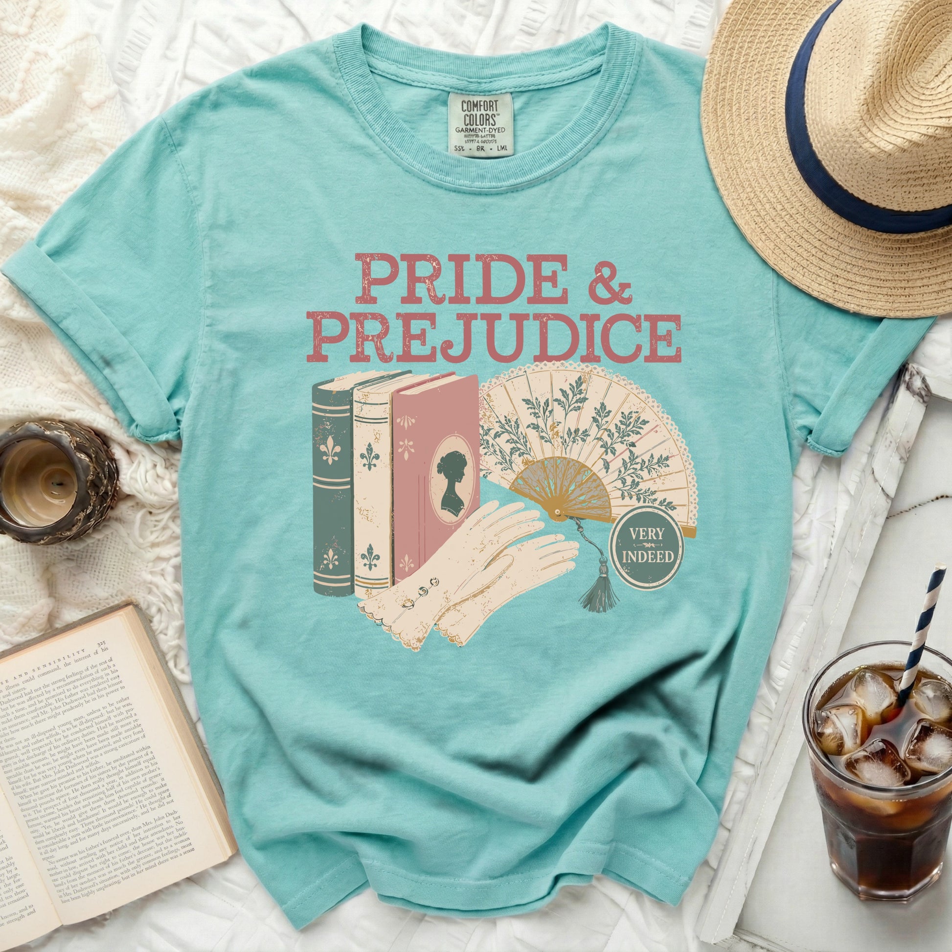 Turquoise t-shirt with "Pride & Prejudice" design and vintage illustrations.