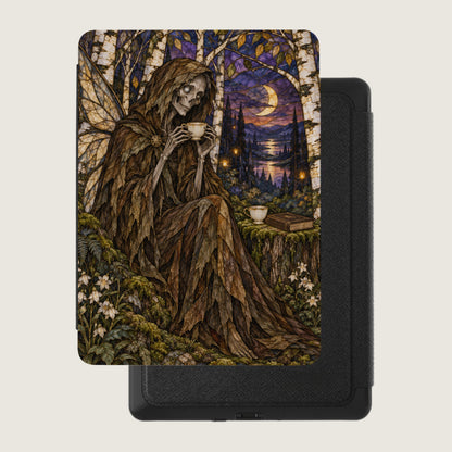Skeleton in leaf cloak drinks tea by a moonlit forest lake, sitting near a book.