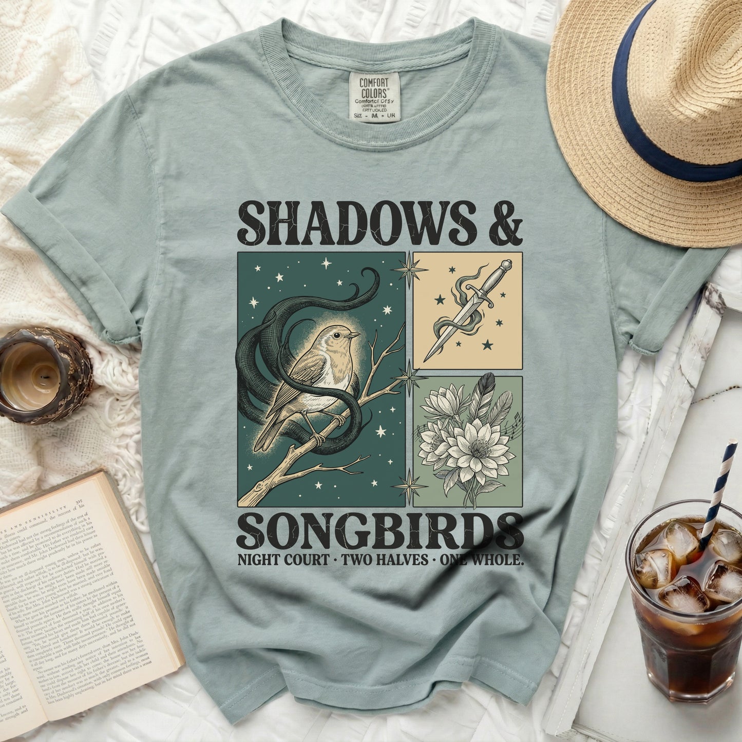 T-shirt with "Shadows & Songbirds" and illustrated bird, dagger, and flowers.