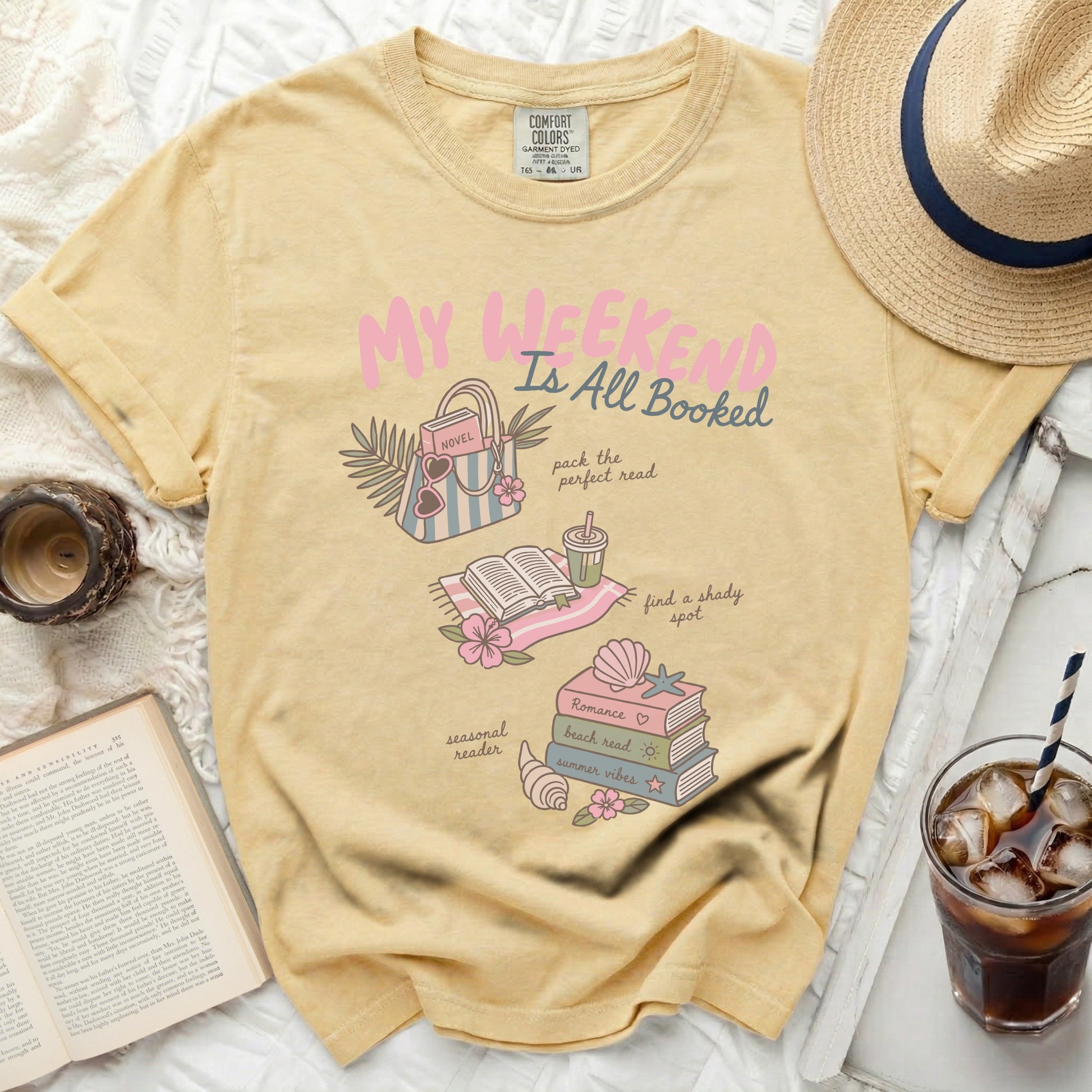Yellow t-shirt with "My Weekend All Booked" graphic and book illustrations.
