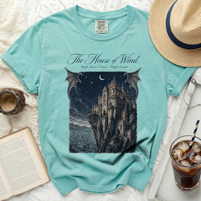 Teal t-shirt with "The House of Wind" and castle graphic.