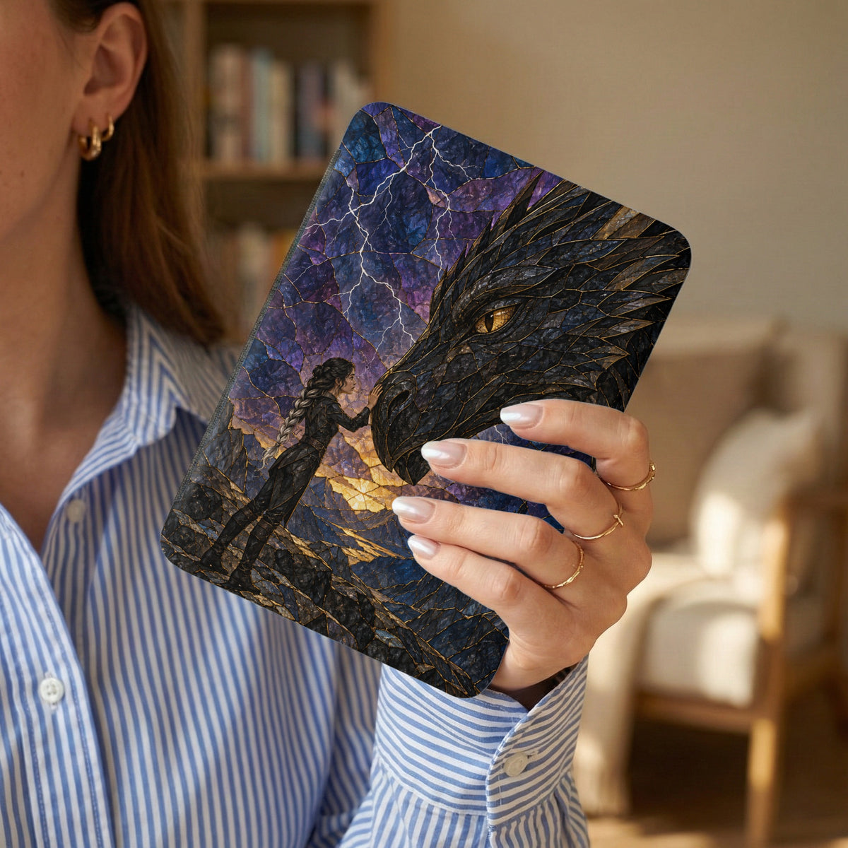 E-reader case featuring a woman touching a dragon's face against a stormy sky.