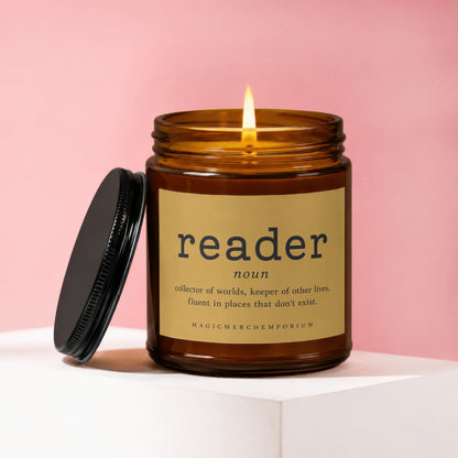 Amber jar candle with lit flame, labeled "reader".