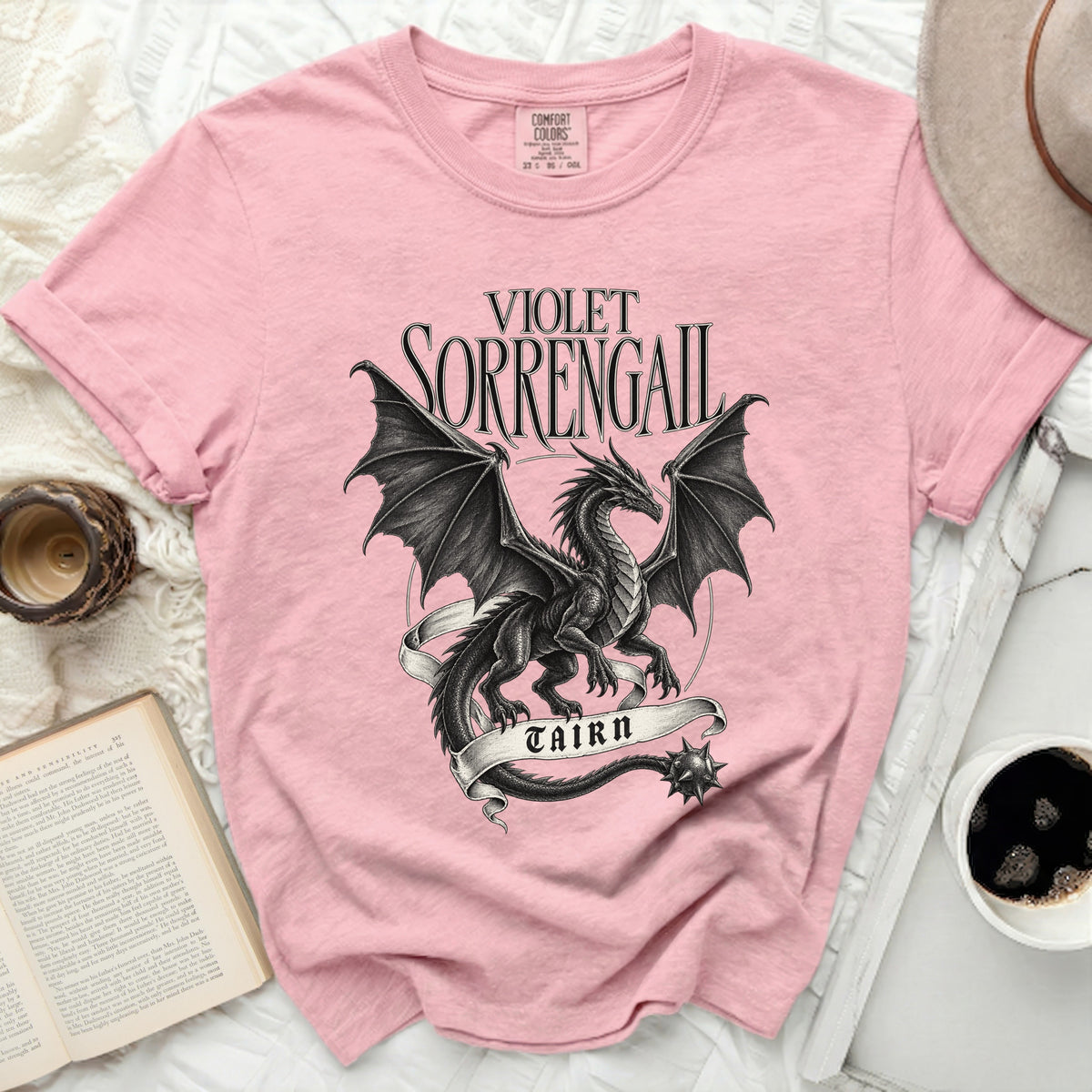 Pink t-shirt with a black dragon graphic and "VIOLET SORRENGAIL TAIRN" text.