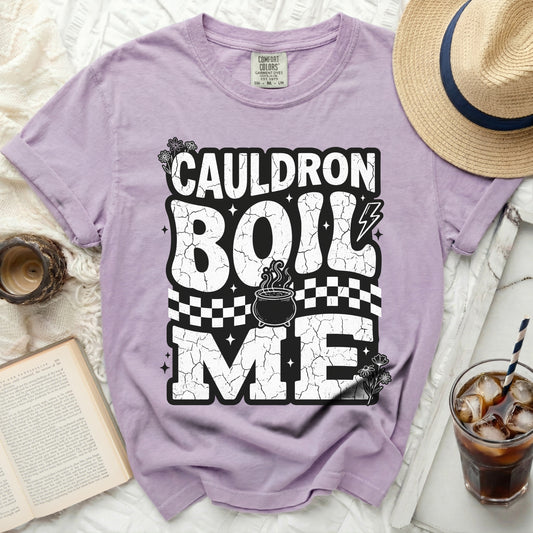 Purple t-shirt with "Cauldron Boil Me" text and Halloween graphics.