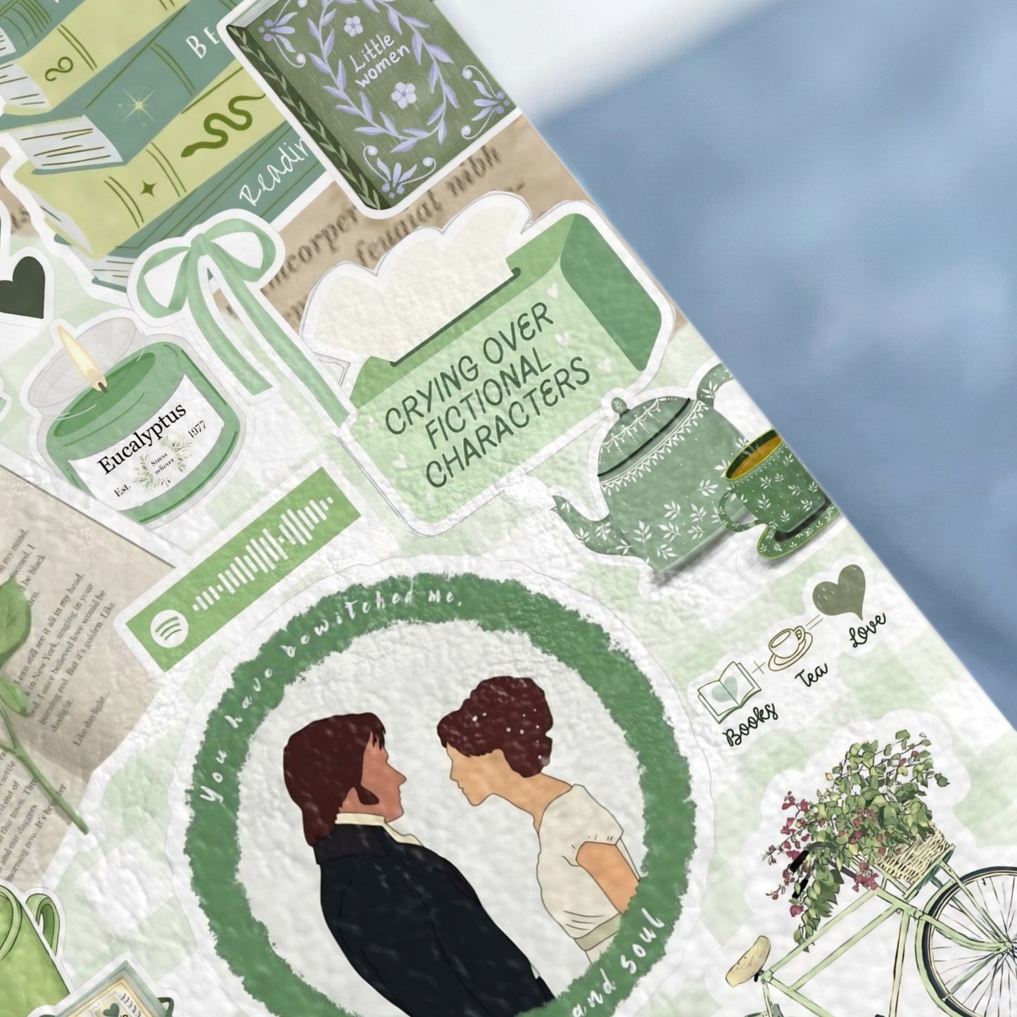 Book-themed stickers with a couple, candle, tea set, and bicycle.