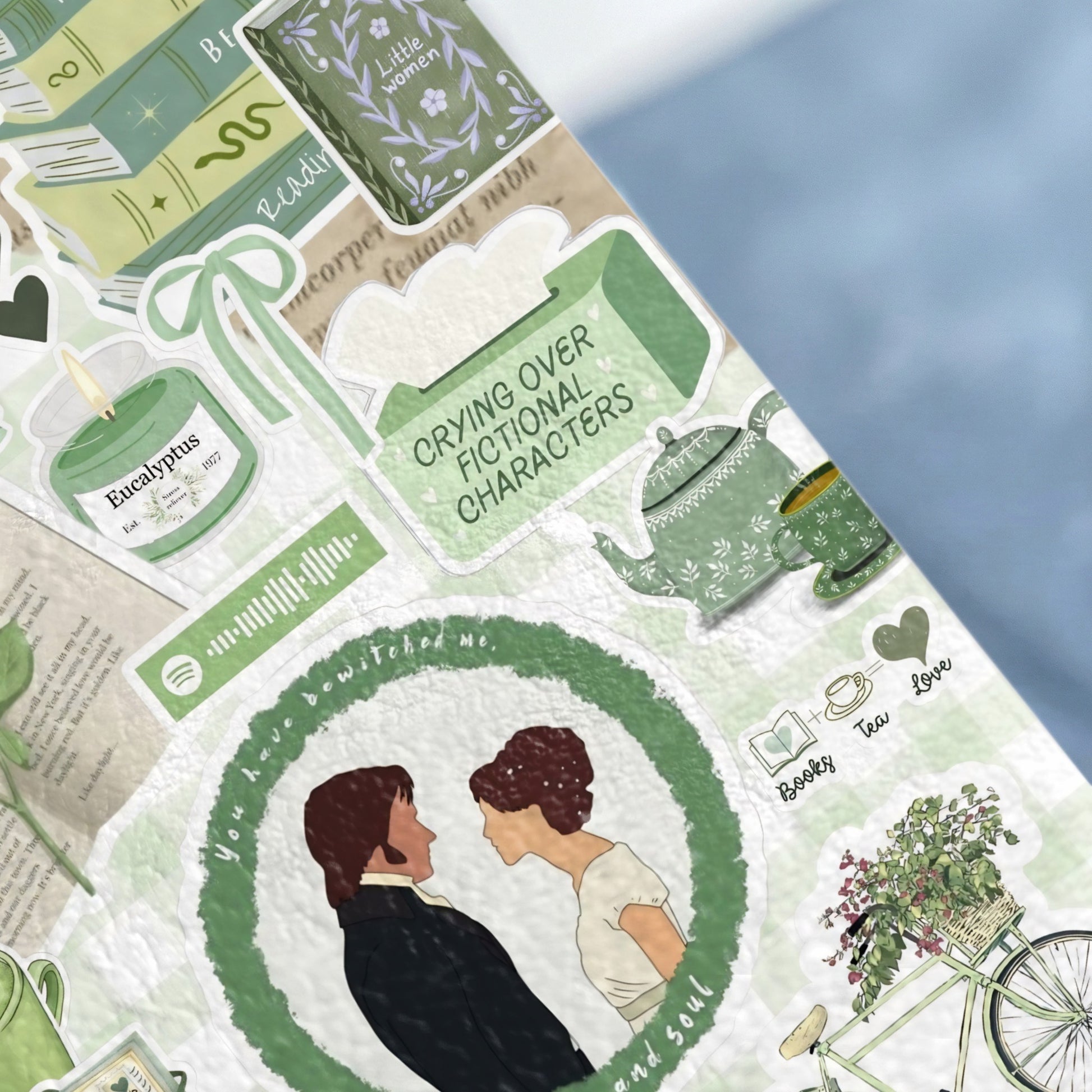 Book-themed stickers with a couple, candle, tea set, and bicycle.
