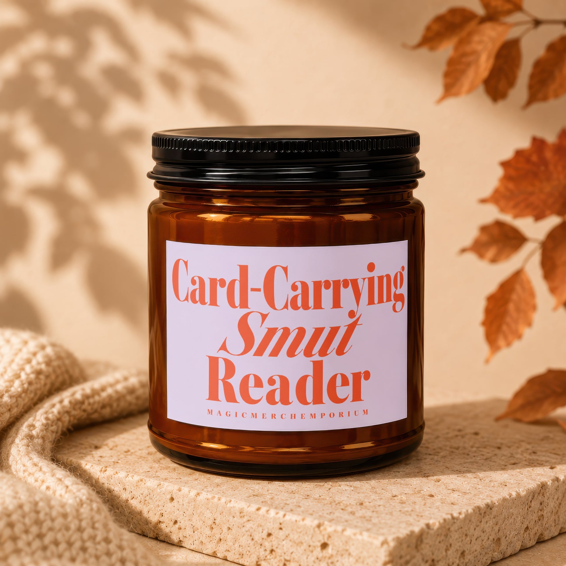 Amber jar candle with "Card-Carrying Smut Reader" text.