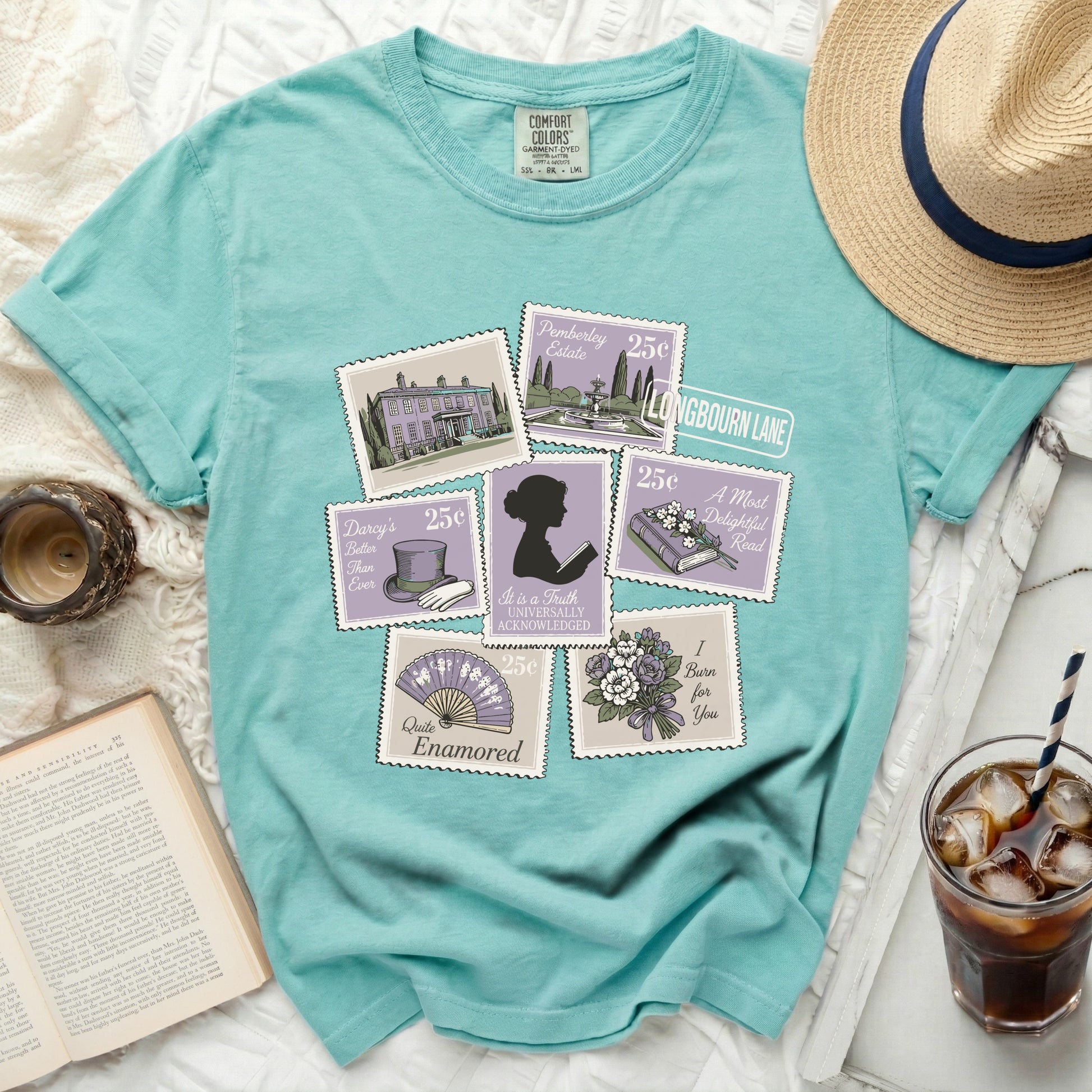 Comfort Colors teal t-shirt with postage stamp designs and literary quotes.