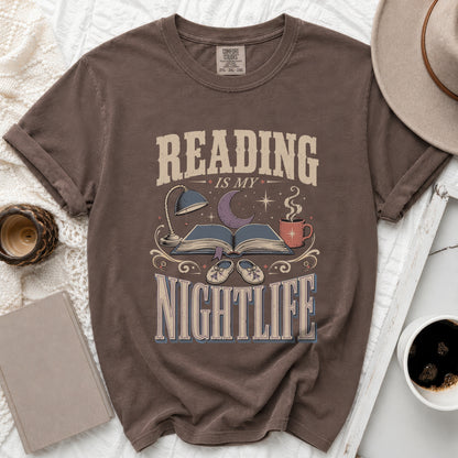 Brown t-shirt with "Reading is my nightlife" graphic and book, moon, and coffee cup.