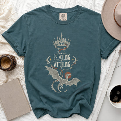 Teal t-shirt with "PRINCELING WITCHLING" text, crown, and dragon design.