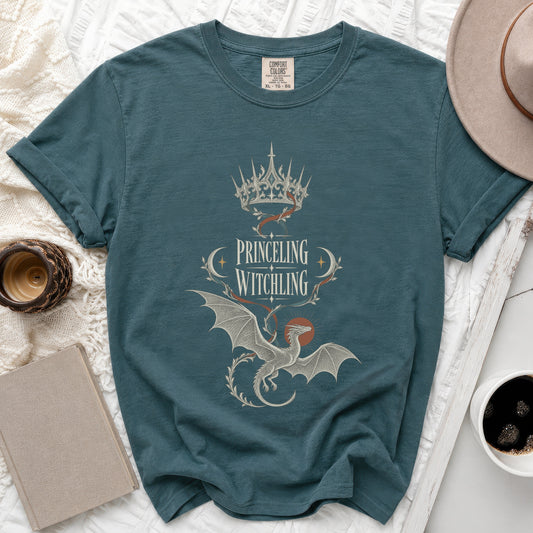 Teal t-shirt with "PRINCELING WITCHLING" text, crown, and dragon design.