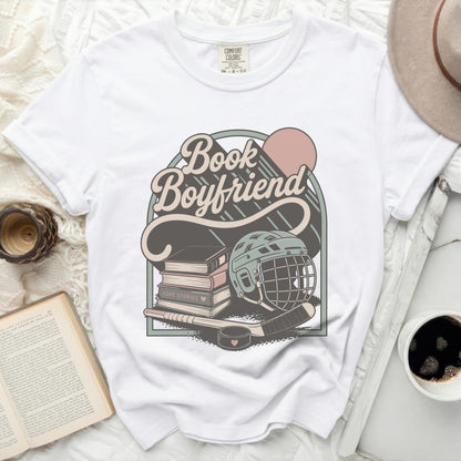 White t-shirt with "Book Boyfriend Love Stories" graphic and hockey theme.