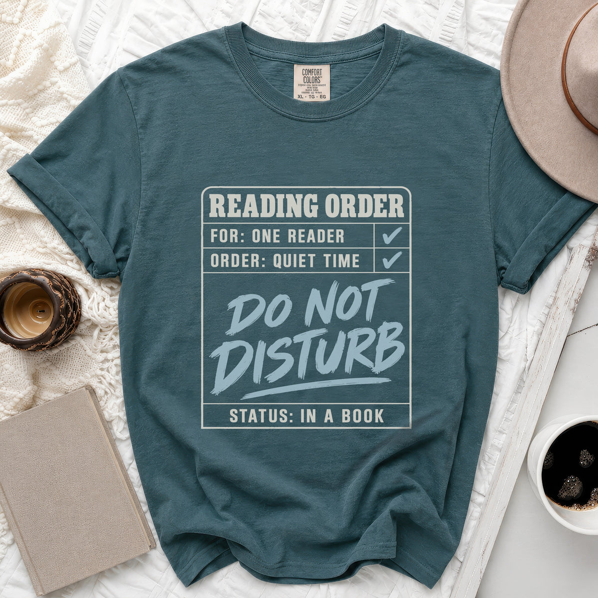 Teal t-shirt with "Reading Order: For One Reader, Order: Quiet Time, Do Not Disturb, Status: In A Book" text.