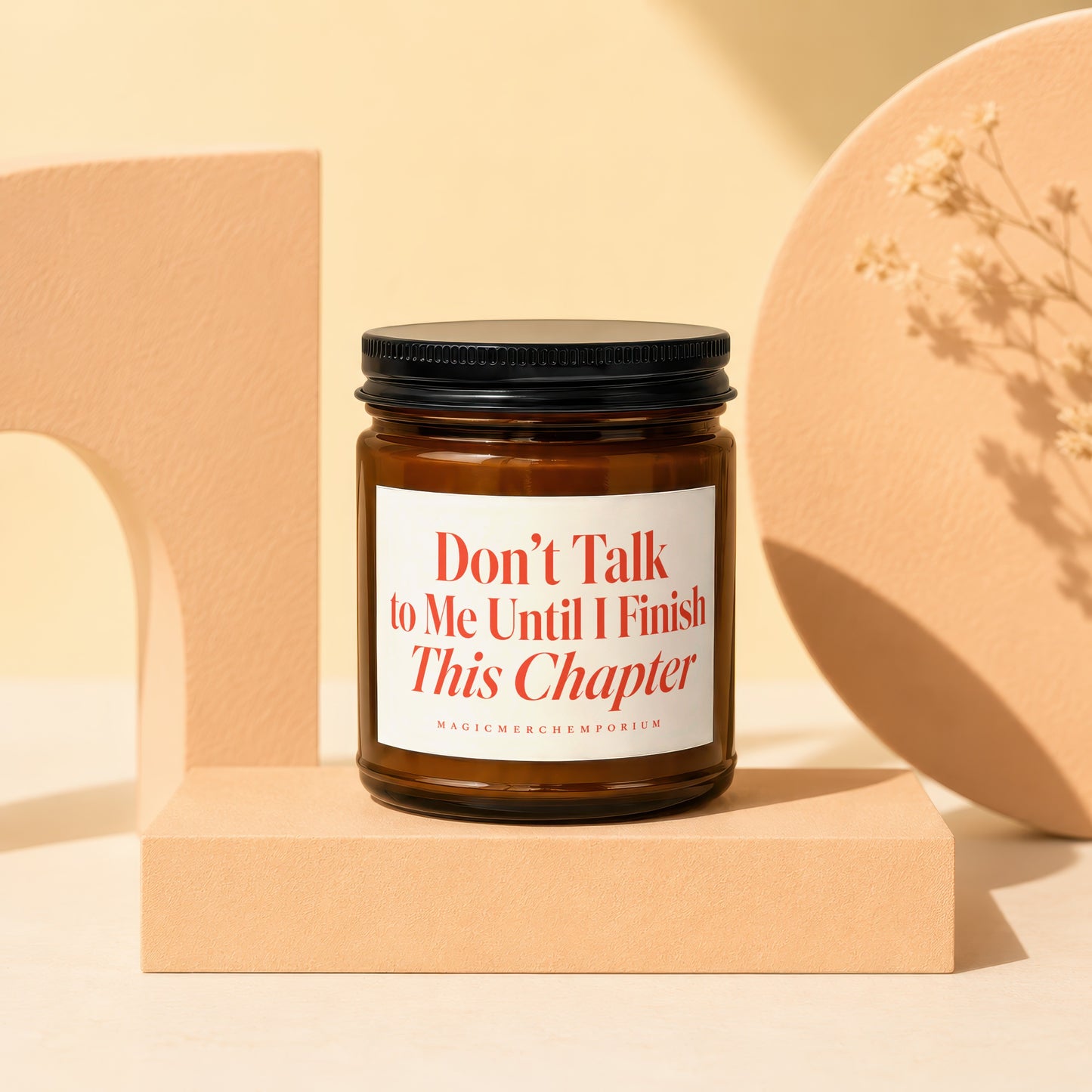 Amber glass candle with "Don't Talk to Me Until I Finish This Chapter" text.