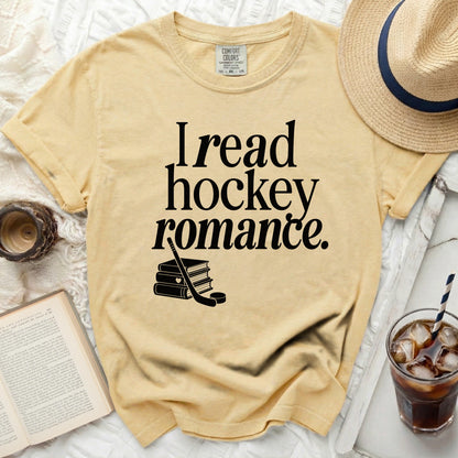 Yellow t-shirt with "I read hockey romance" text and stacked books.