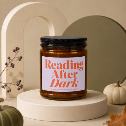 Amber candle with black lid labeled "Reading After Dark" by MagicMerchEmporium.