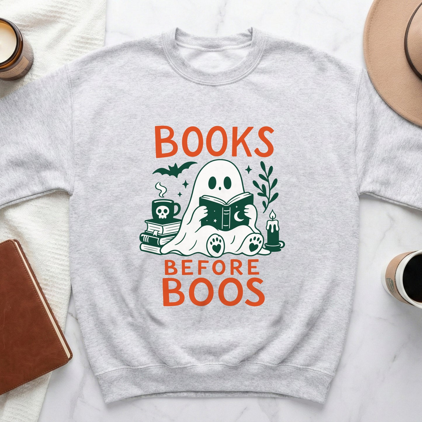 Light grey sweatshirt with "BOOKS BEFORE BOOS" text and a reading ghost graphic.