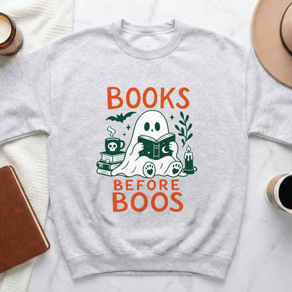 Light grey sweatshirt with "BOOKS BEFORE BOOS" text and a reading ghost graphic.