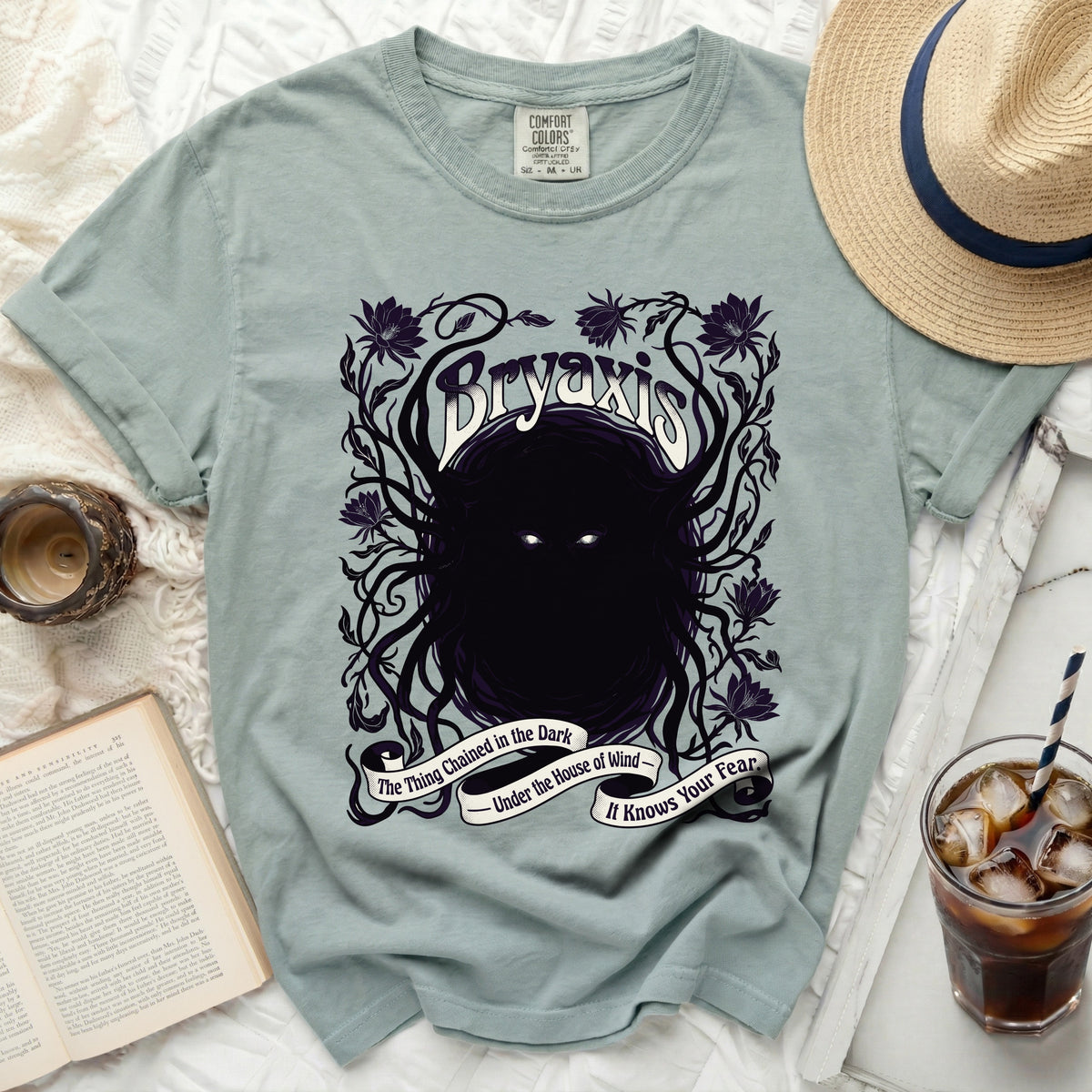 Bryaxis t-shirt with dark floral design and text: The Thing Chained in the Dark.