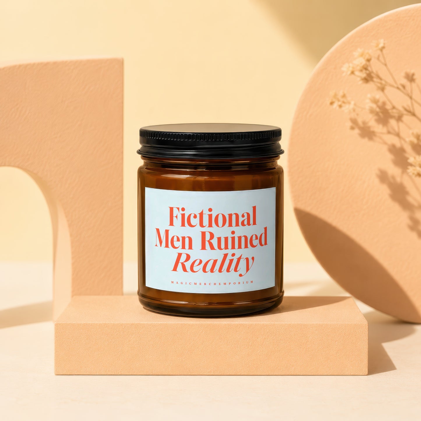 Amber candle with a black lid labeled "Fictional Men Ruined Reality".