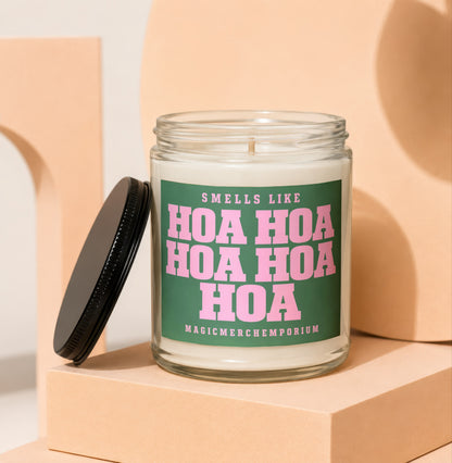 Glass candle with green label that reads "Smells like Hoa Hoa Hoa Hoa Hoa Hoa MagicmerchEmporium".