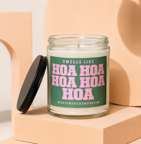 Glass candle with green label that reads "Smells like Hoa Hoa Hoa Hoa Hoa Hoa MagicmerchEmporium".
