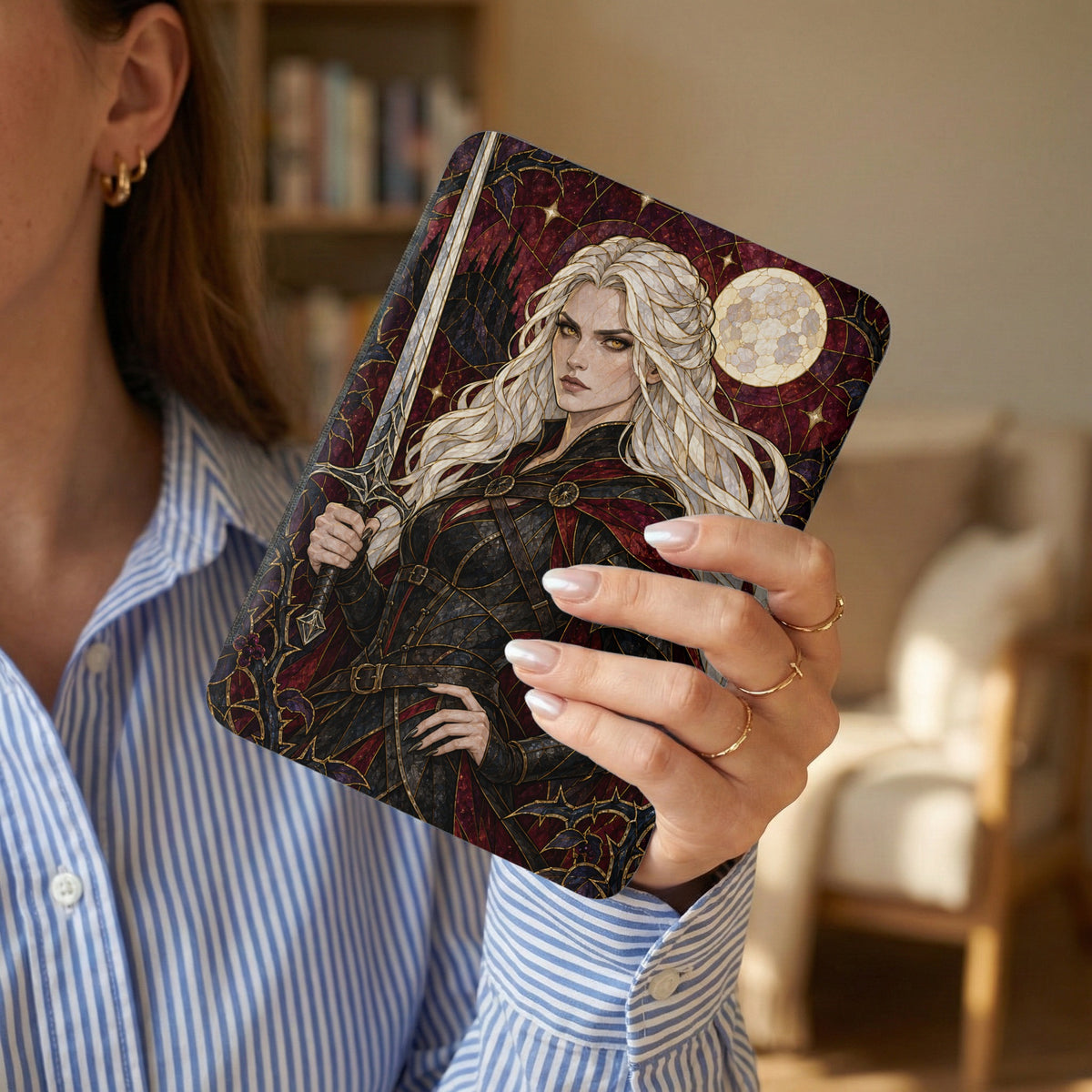 Book cover featuring a blonde warrior woman with a sword and a full moon.