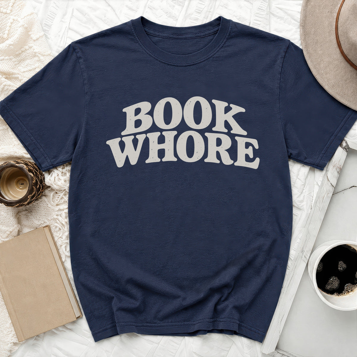 Navy t-shirt with "BOOK WHORE" text in distressed cream lettering.