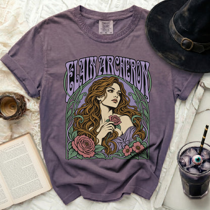 Purple t-shirt with Elaine Archeron and floral art, Comfort Colors tag.